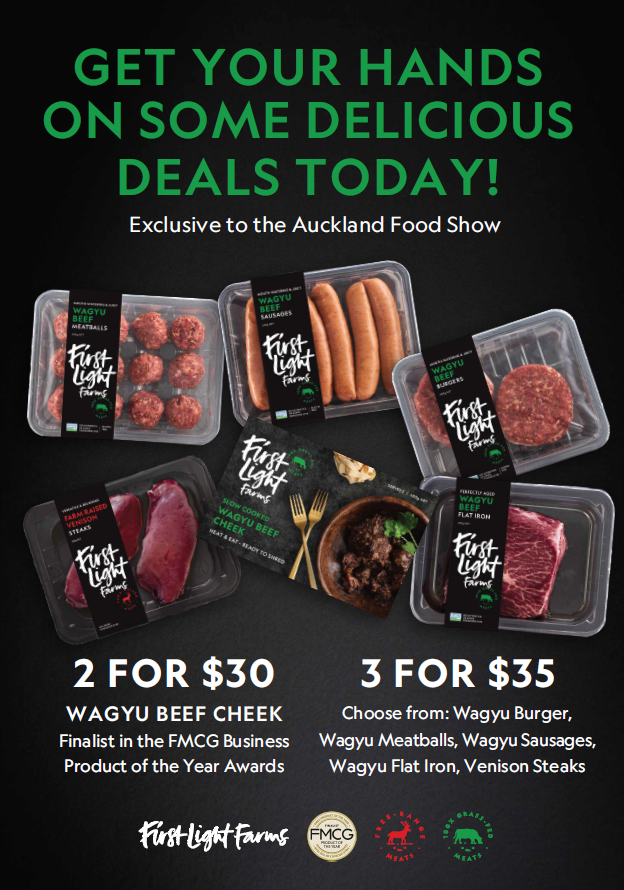 A vibrant food stall at an Auckland food festival, showcasing insect-based snacks.